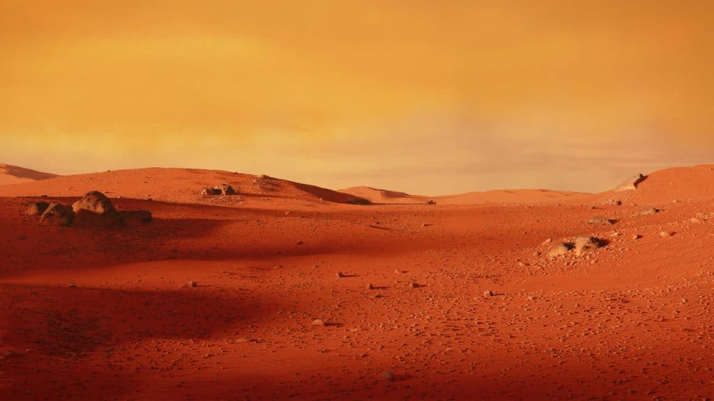 Imagem mostra um cenário de deserto em Marte, detalhando como o planeta vermelho era bem diferente em milhões de anos atrás