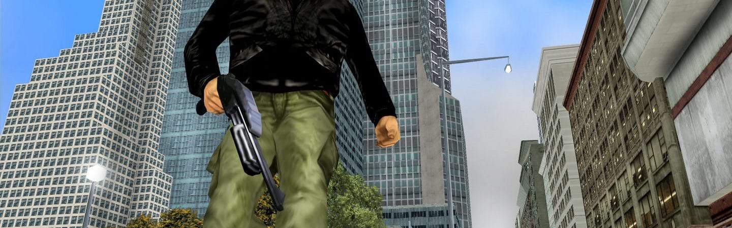 Imagem mostra cena de GTA III, com personagem segurando arma enquanto caminha em área urbana. Ele é um homem de cabelo preto, com calça verde e jaqueta preta.