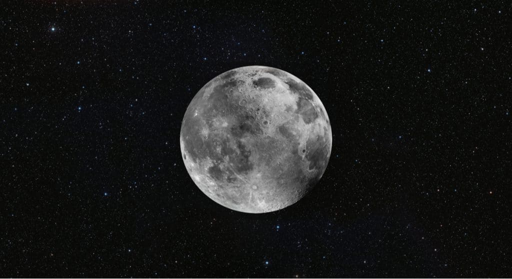Imagem da Lua no céu noturno, com várias estrelas ao seu redor