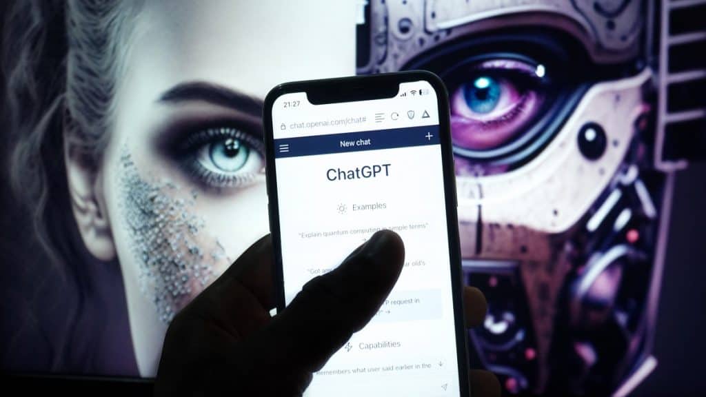 Person with ChatGPT open on iPhone with AI image in background